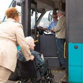 Community Coach and Go-Line Public Transportation lady getting on bus